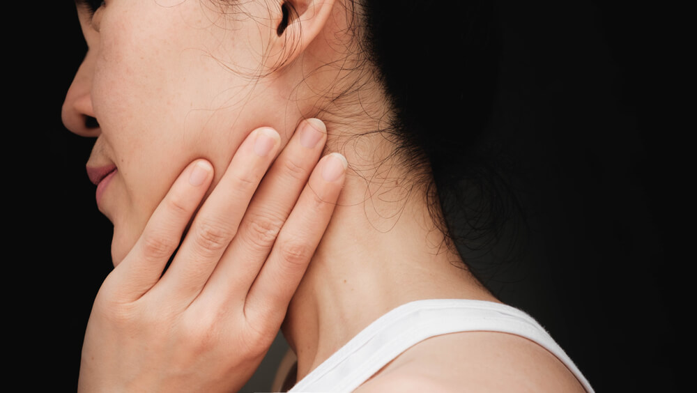 Two exercises to treat TMJ pain behind the ear in St. Louis, MO shutterstock 781018936 tmj pain behind the ear