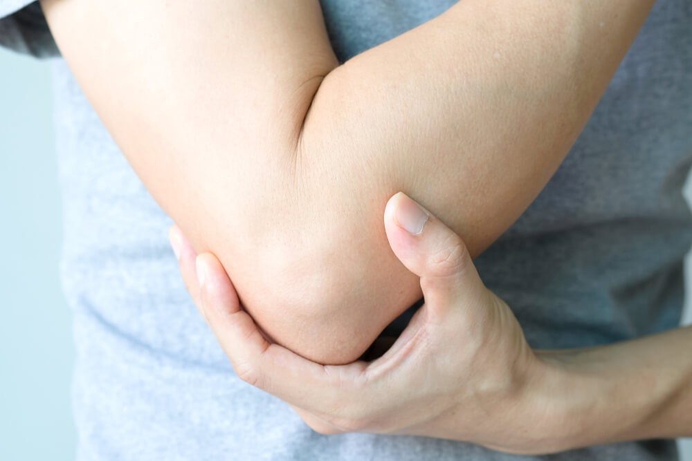 you might not think too much about it, but your elbows move a lot during a normal day. they bend to lift your morning cup of coffee to your lips. they twist to turn doorknobs. bending and straightening so many times every day can leave your elbows vulnerable to injury. in fact, one medical article reports that injuries like tennis elbow affect up to 3% of the u.s. population every year. people who are feeling pain when bending or straightening their elbow can find help from a physical therapist. these specialists have many techniques at their disposal, and they can combine them into a personalized plan to reduce your pain. therapeutic exercises are commonly used to treat elbow pain. there are two exercises in particular that your therapist might prescribe. wrist extensor stretch tightness in your forearm muscles is one common cause of tennis elbow, and it can also lead to elbow pain when bending or straightening your arm. physical therapists can show you how to stretch forearm muscles to reduce tightness. one exercise often used for this purpose is the wrist extensor stretch. how to do the wrist extensor stretch start by holding the affected arm straight out in front of you with your palm down. you can also rest your forearm on a table or countertop if you have trouble maintaining this position; just make sure your wrist is hanging over the edge of the surface. grasp the fingers of the affected hand with your other hand. slowly pull downward toward the floor until you feel a stretch in the outside of your forearm. hold the stretch for 10 to 15 seconds. release the stretch and rest your arm for 10 seconds. repeat these steps until you’ve done three repetitions. wrist turn physical therapists can also show you exercises that can strengthen the forearm muscles. improving strength in these muscles can help decrease pain in your elbow when it’s bent or straightened, and this goal can be accomplished with the wrist turn exercise. how to do the wrist turn exercise place the affected forearm on a table, countertop or other flat surface; your wrist should be over the edge of the surface, and your palm should be facing up. slowly turn your hand inward so that your palm is facing down. concentrate on tightening the forearm muscles during this movement. hold this position for three to five seconds. return your hand to the starting position and rest for five seconds. repeat these steps until you’ve done three sets of five repetitions. you can also use a light hand weight or can of soup to add weight, which will make the exercise more challenging. elbow pain when bending and straightening your arm can be treated at excel sports & physical therapy are you feeling pain every time your elbow is bent and straightened? excel sports & physical therapy offers treatment options that can help. our clinics offer free screenings to help you get your treatment started. we also create individualized therapy plans that meet each patient’s specific needs, and our plans often include beneficial therapy methods such as: therapeutic exercises joint mobilization kinesio taping® hand therapy joint mobilization don’t wait to start getting our help with your elbow pain. contact our team today for more information about how we can help you or to schedule an initial appointment.
