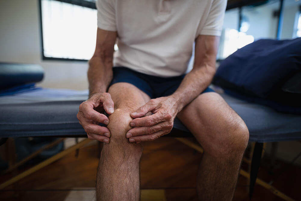 Knee popping after ACL surgery? Learn why & what to do about it midsection of senior male patient holding knee in 2021 08 28 16 46 28 utc knee popping after acl surgery? learn why & what to do about it post-surgical rehab